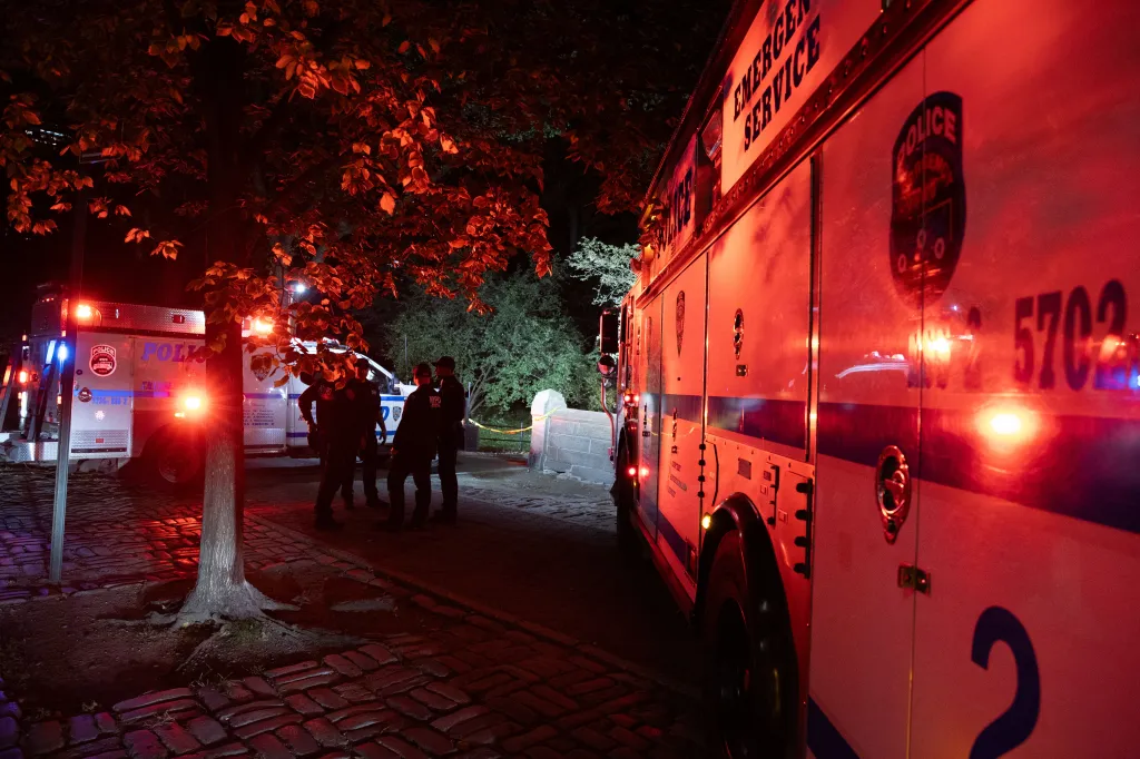 Police stand at the scene of an assault in Central Park.