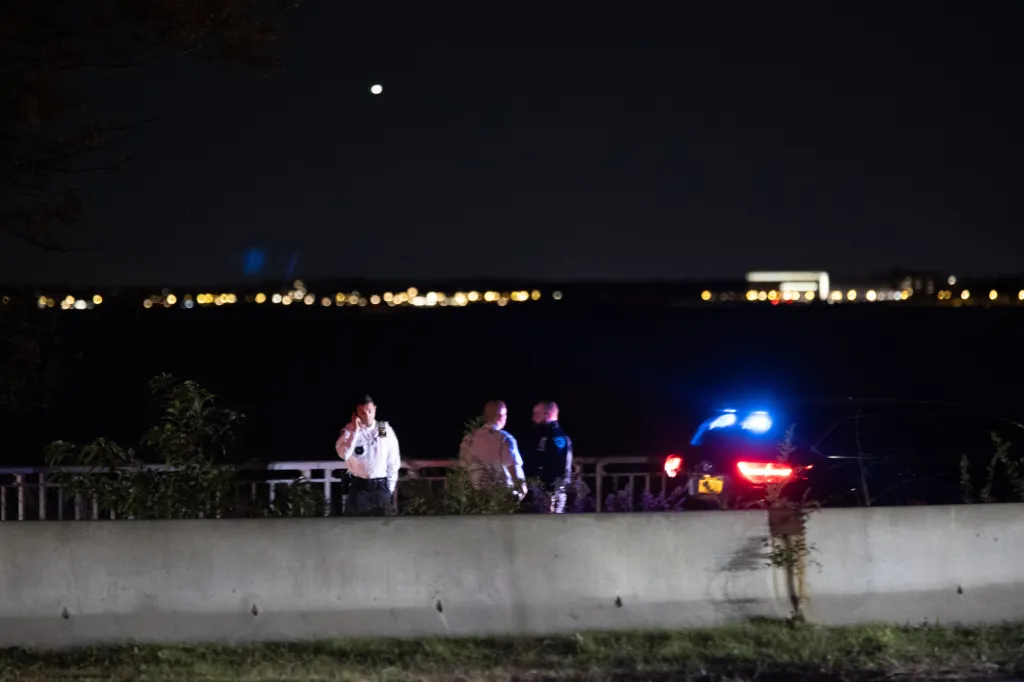 Police officers at the scene of the stabbing on the Belt Parkway bike path in Brooklyn.