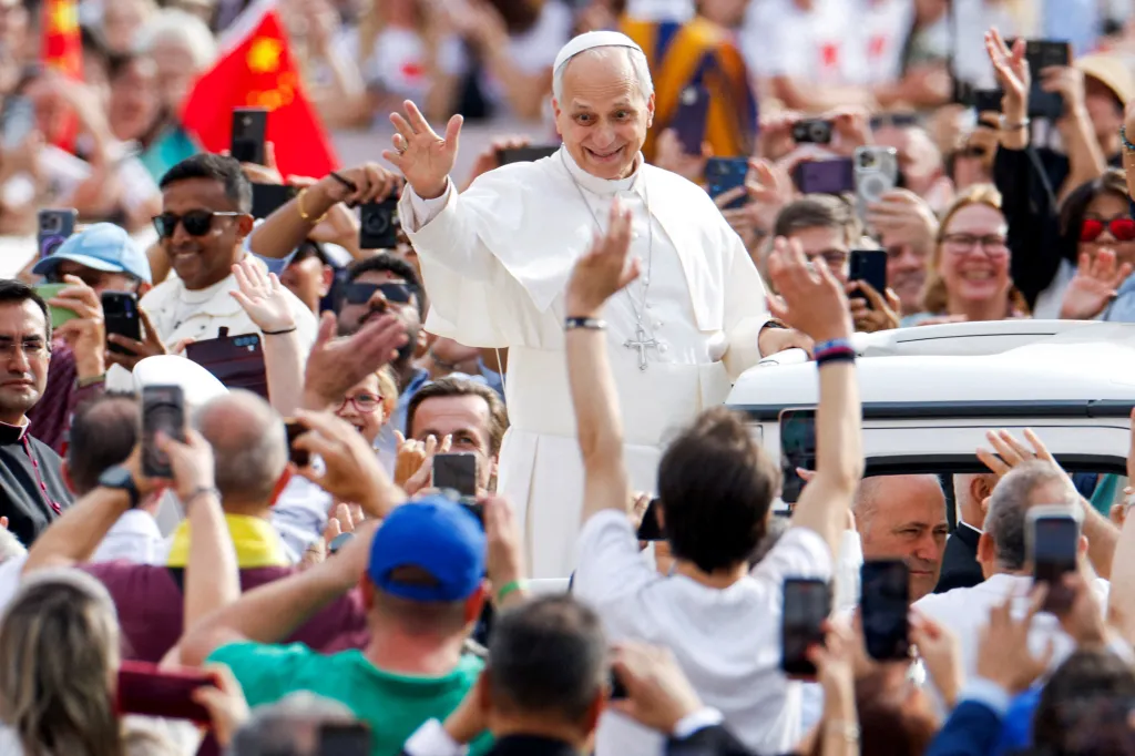 Pope Leo greets the faithful from a vehicle during a weekly general audience in St. Peter's Square at the Vatican.