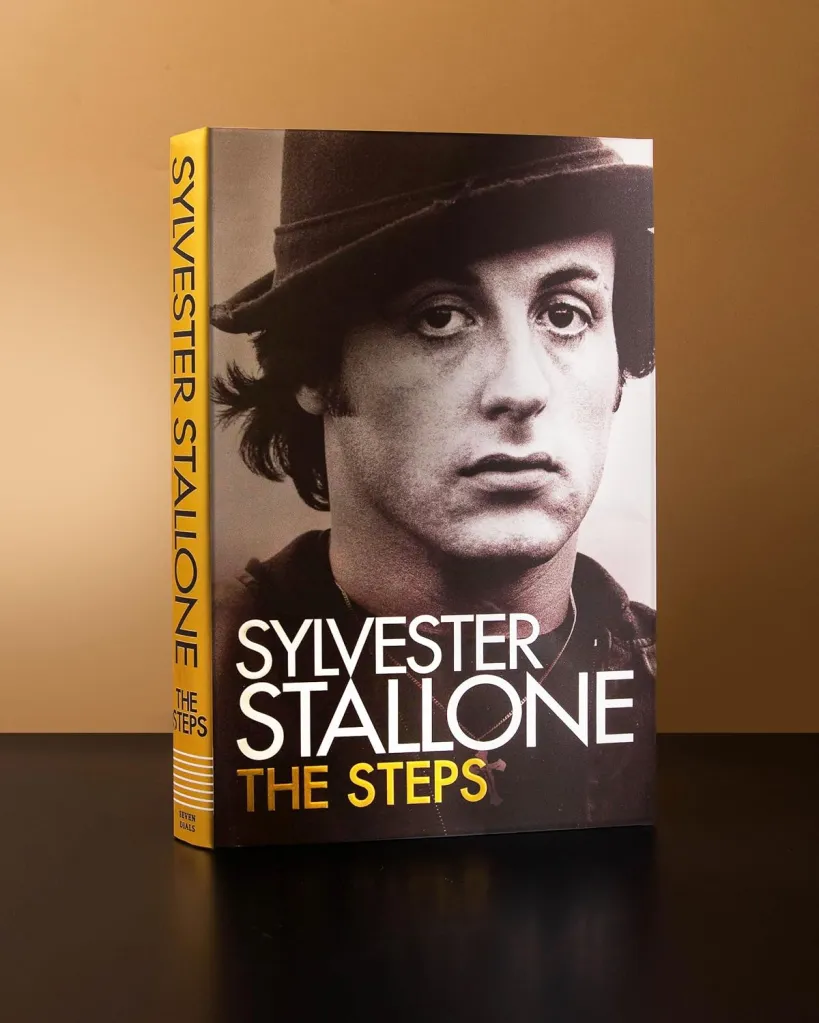 Book cover of The Steps, a memoir by Sylvester Stallone featuring a black and white portrait of him wearing a hat on the cover.