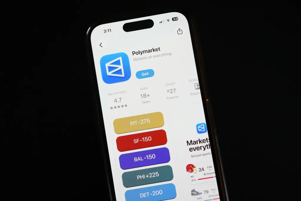 The prediction market app Polymarket is displayed on a mobile phone.