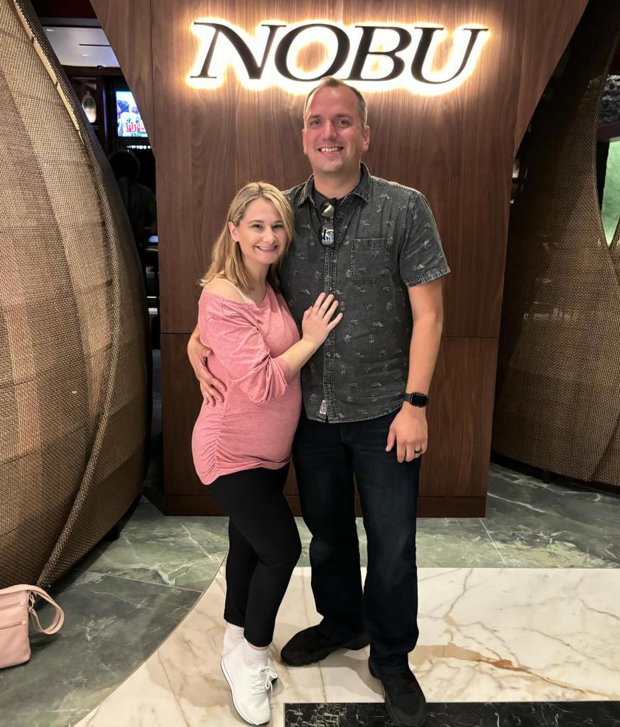 Gypsy-Rose Blanchard and Ken Urker posing together in front of a Nobu sign.