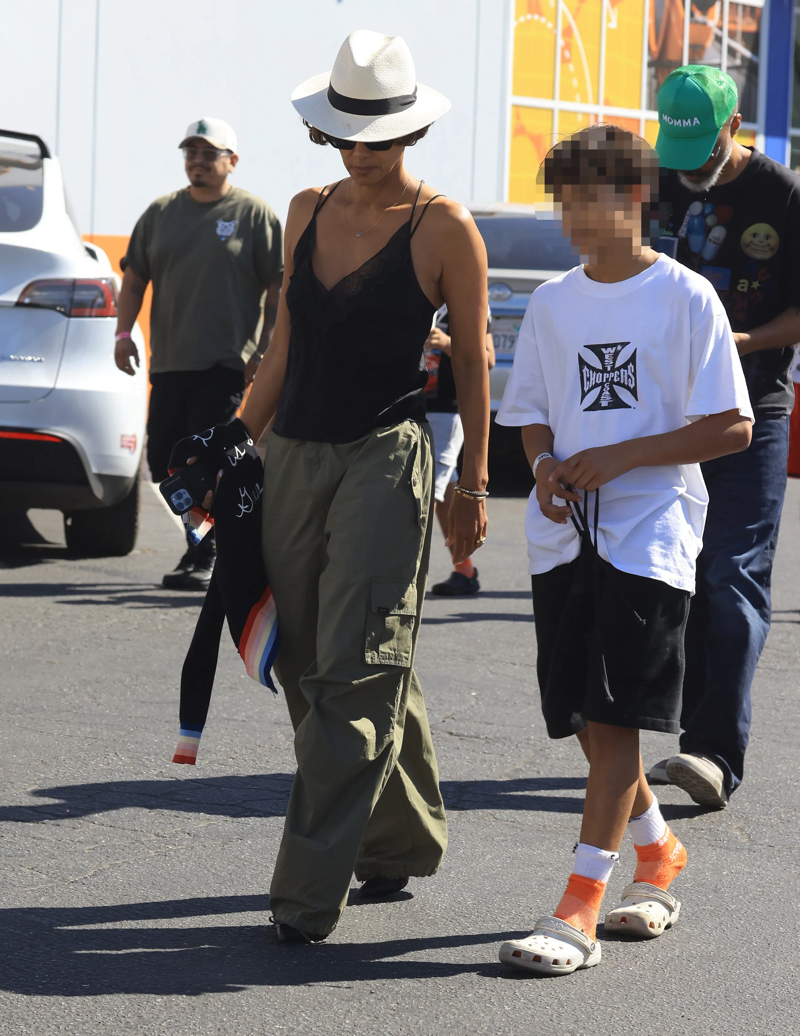 Halle Berry walks outside with her son Maceo Robert Martinez and partner Van Hunt.