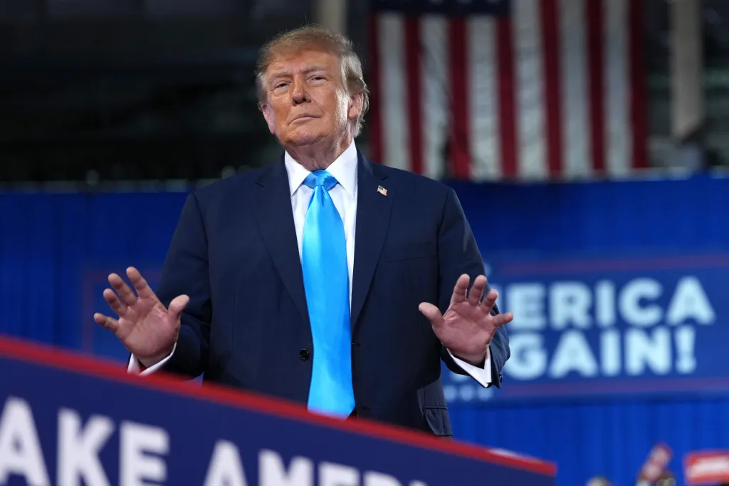 President Donald Trump gestures while speaking at a campaign rally.