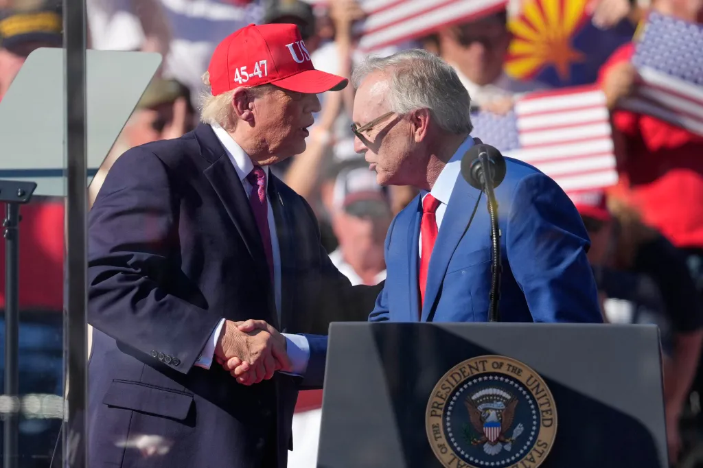 President Donald Trump greets Arizona gubernatorial candidate Rep. Andy Biggs at a campaign rally.