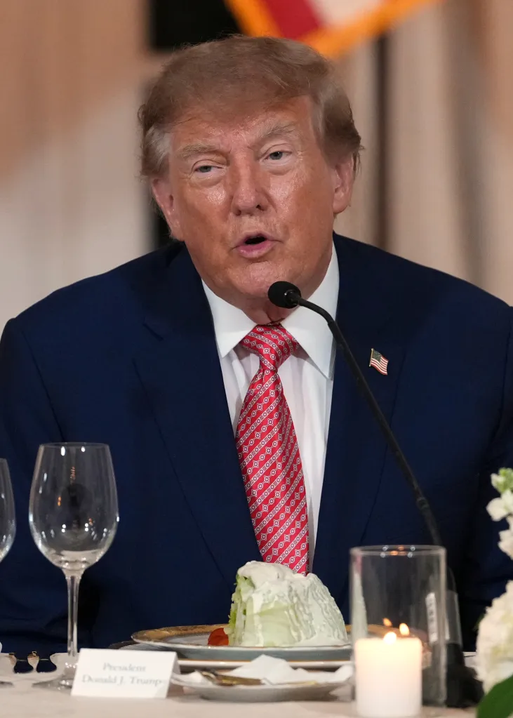 President Donald Trump speaks at a dinner at his Mar-a-Lago club.