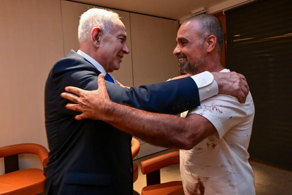 Prime Minister Netanyahu meets Yaniv Hayun, who broke into the cockpit on a flight from Dubai to Israel, at Ben Gurion Airport.