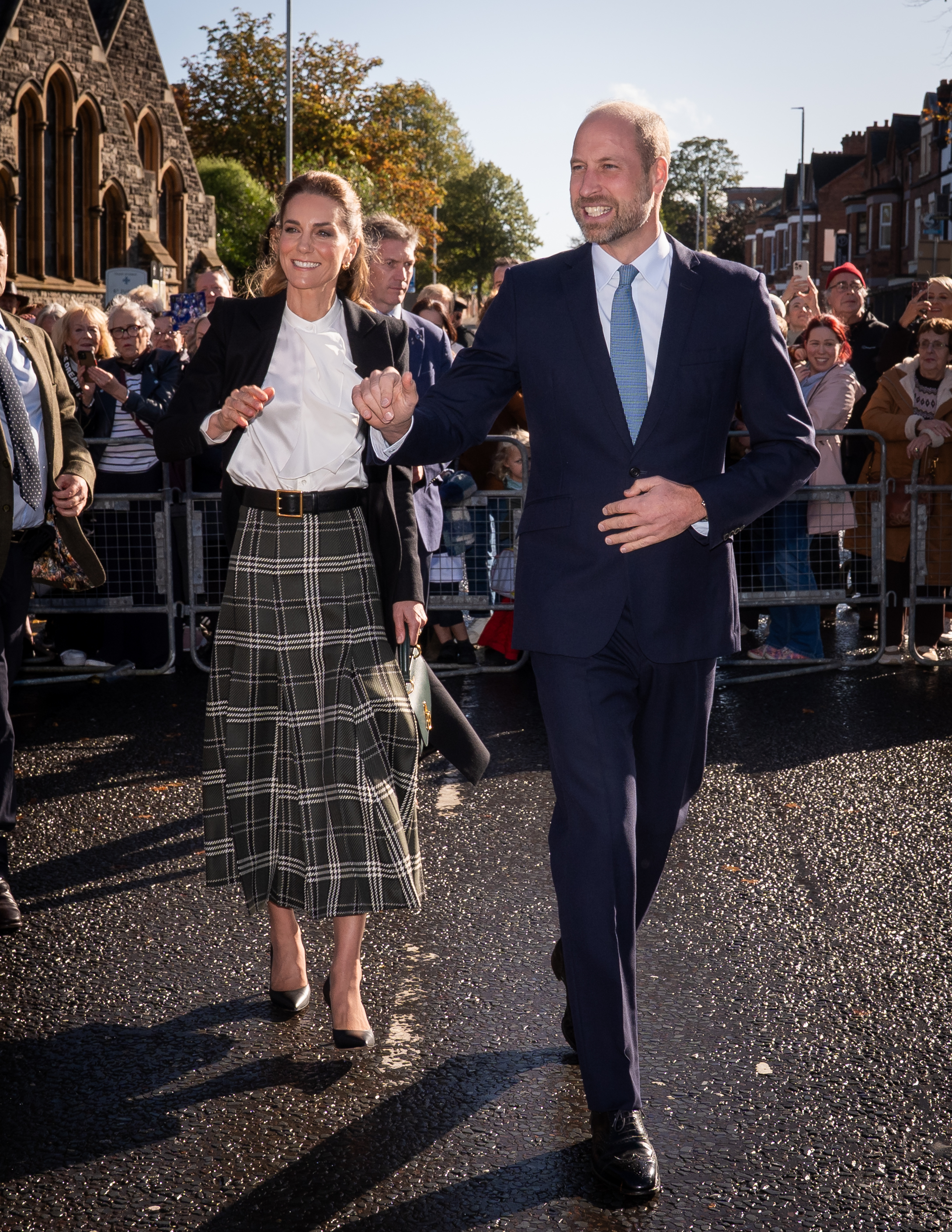 Prince William and Kate Middleton greeting members of the public during a royal visit in Belfast.