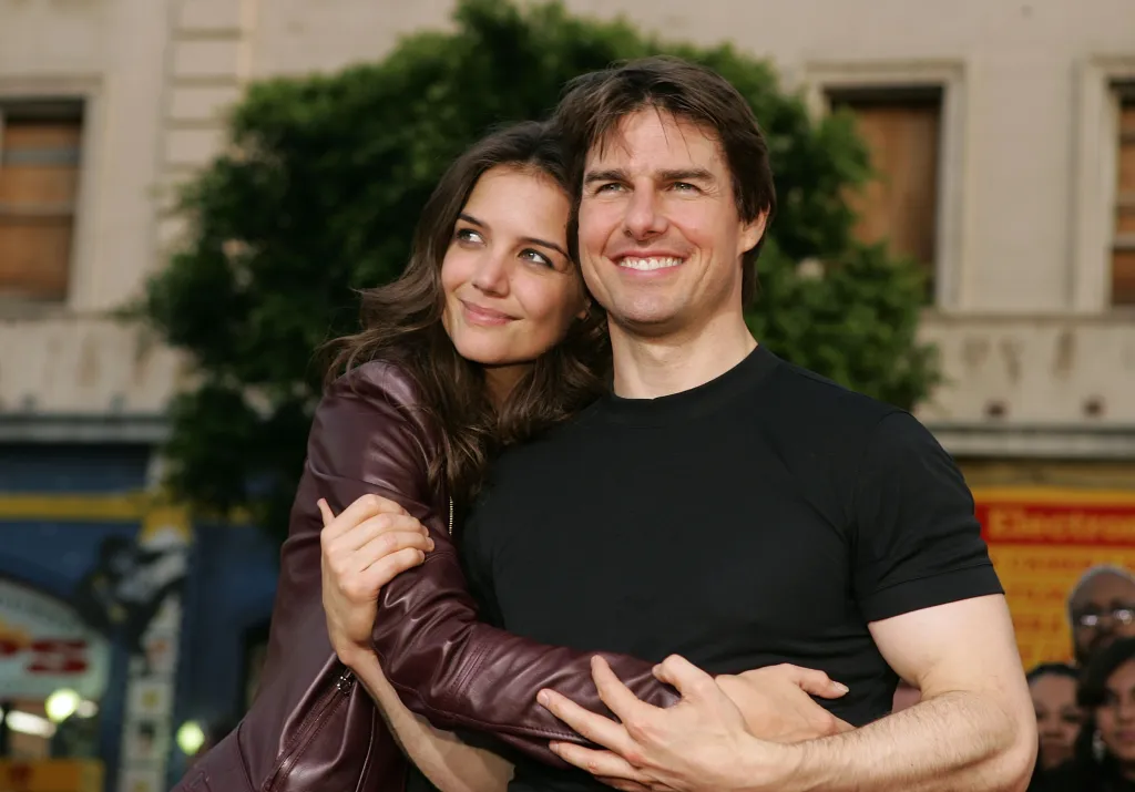 Tom Cruise and Katie Holmes embracing at the 