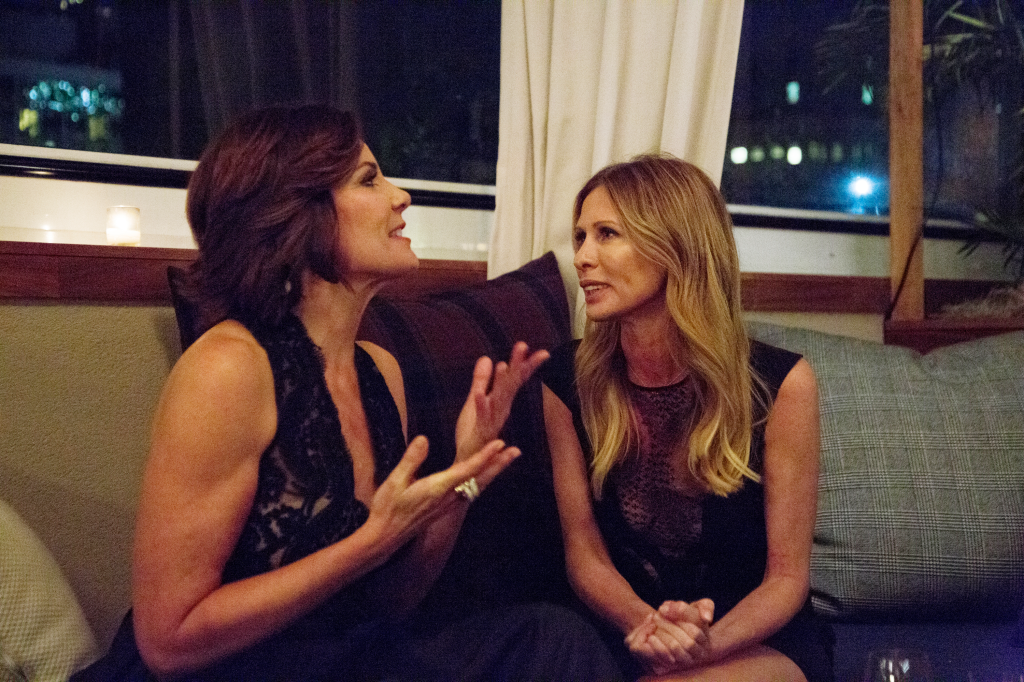 LuAnn de Lesseps and Carole Radziwill sitting together and talking on The Real Housewives of New York City.