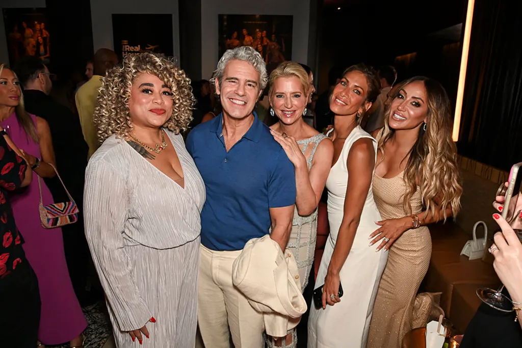 Andy Cohen, Dorinda Medley, Erin Lichy, and Melissa Gorga pose together at a launch event.