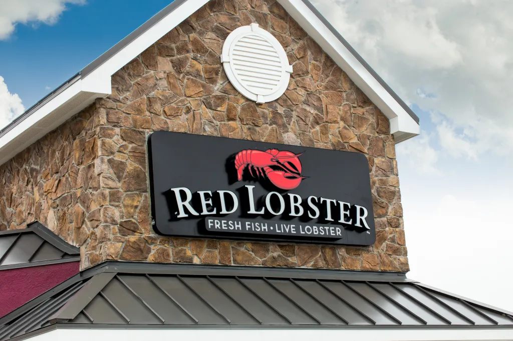 Exterior of a Red Lobster restaurant showing the building's stone facade and restaurant sign.