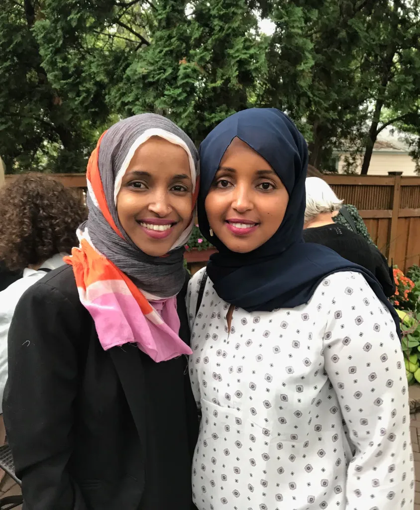 Ilhan Omar, left, stands with her sister Sahra Noor.