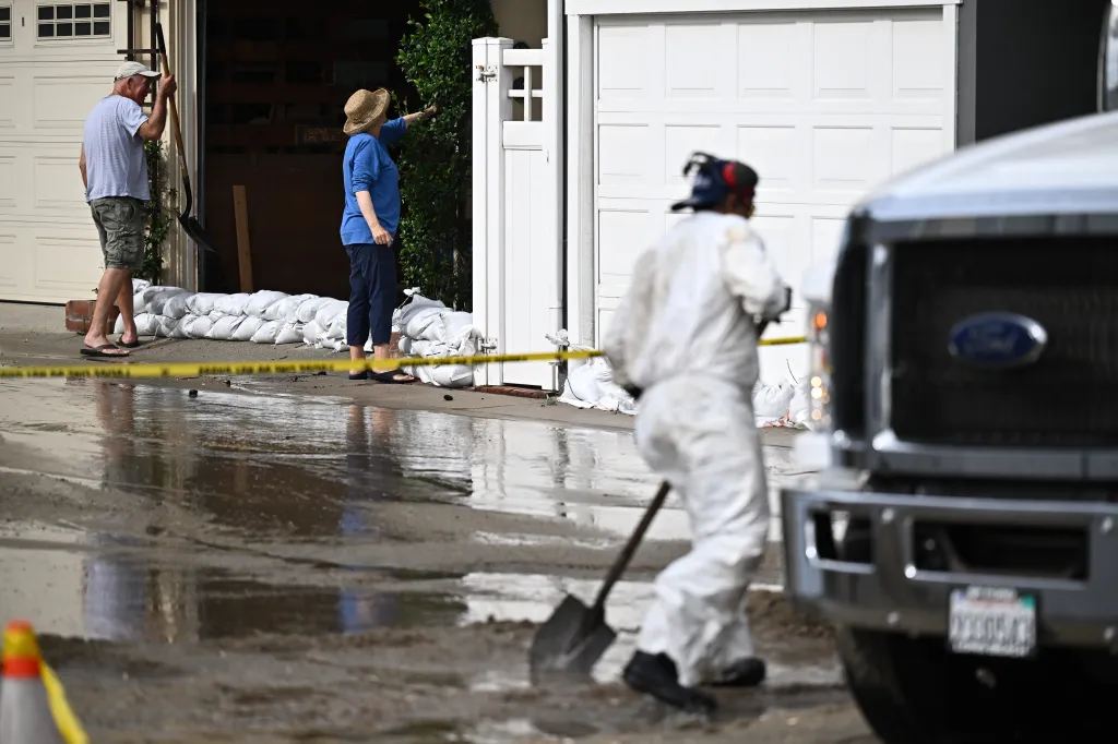 Residents check on their homes in Long Beach, Calif.