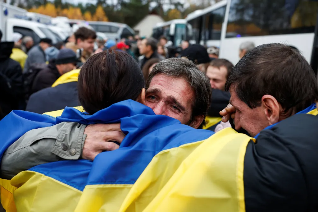 Residents evacuated from Oleshky are welcomed upon returning to Ukrainian-controlled territory.