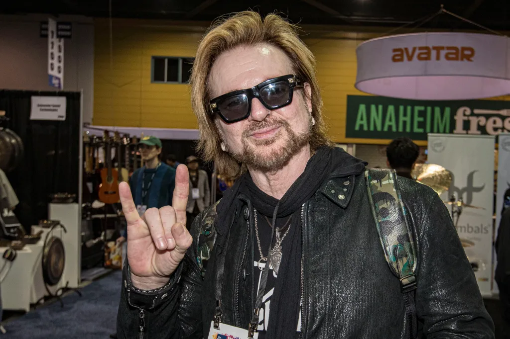 Rikki Rockett of Poison poses at the NAMM Show.