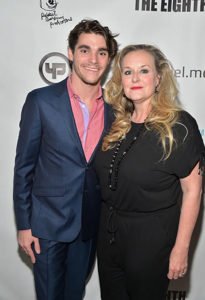 RJ Mitte and his mother, Dyna Mitte, pose together at an event.