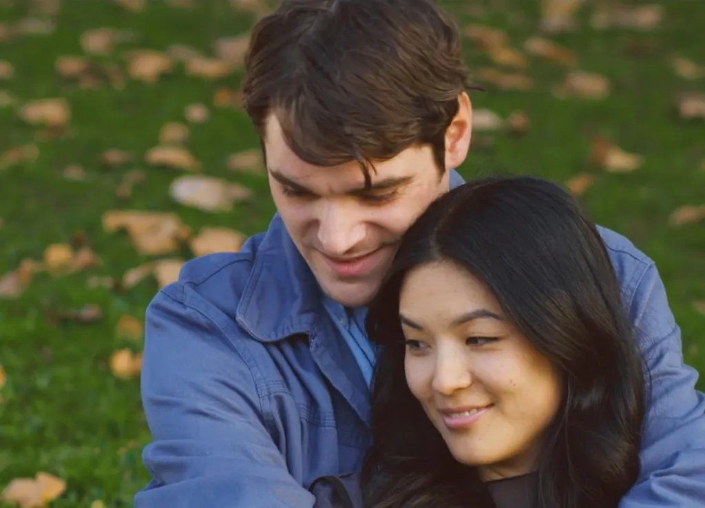 RJ Mitte and a woman hugging outdoors in the movie 