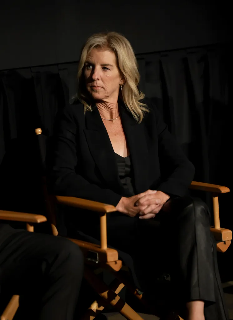 Rory Kennedy sitting in a director's chair during a screening.