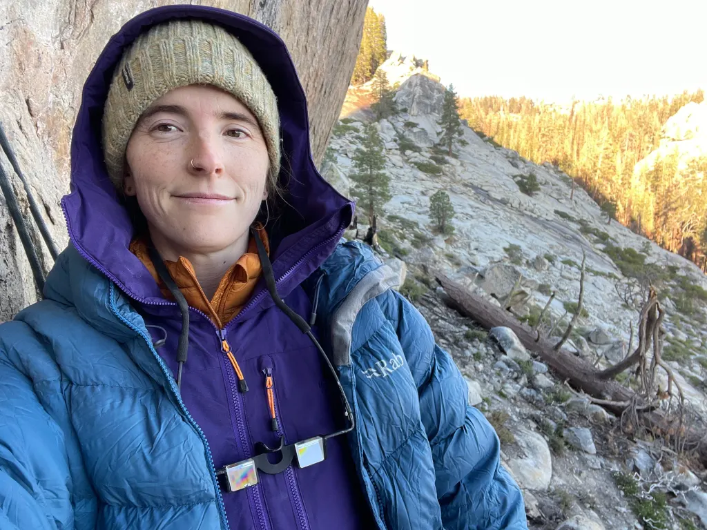 Rosie Bates, 36, posing outdoors near a rocky hillside.