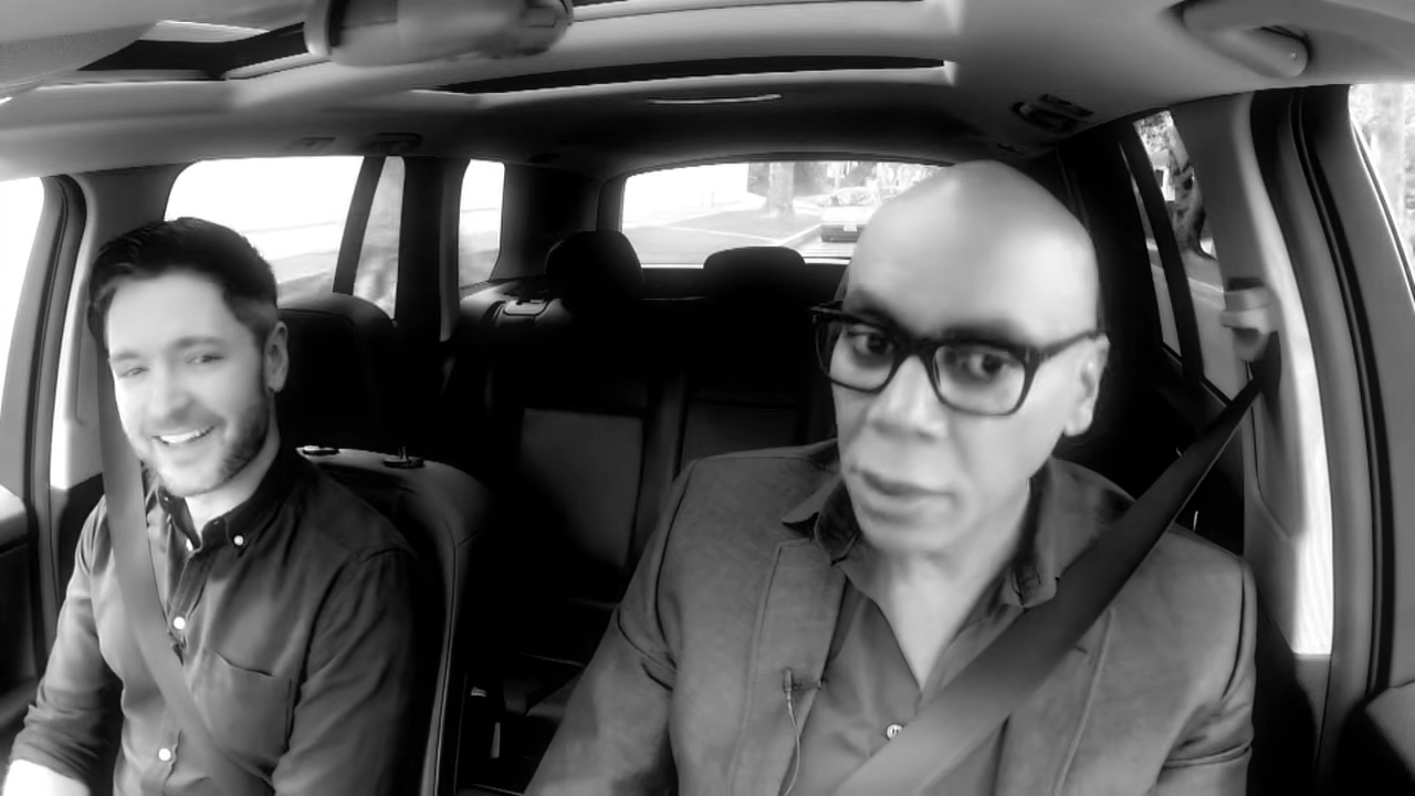 RuPaul and Lucian Piane in a car.