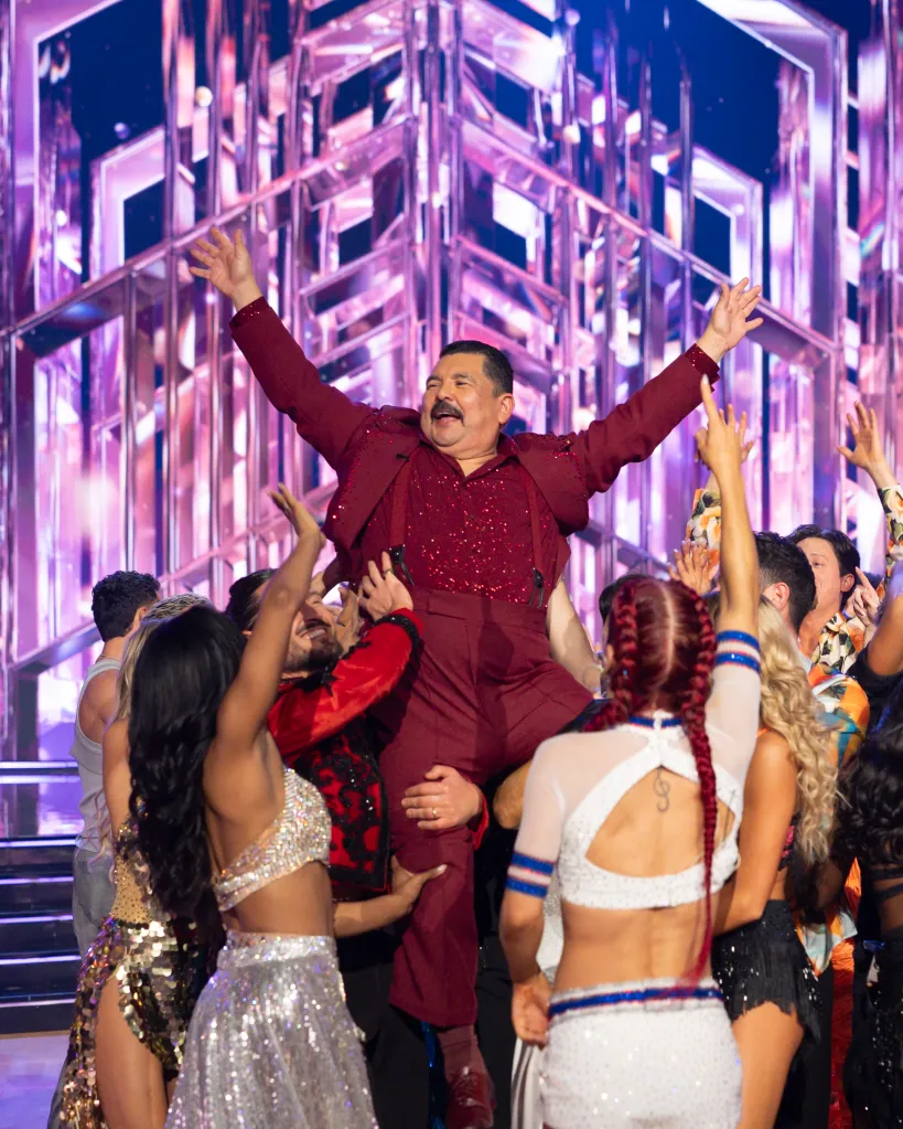 Guillermo Rodriguez is lifted into the air by dancers on Dancing with the Stars.