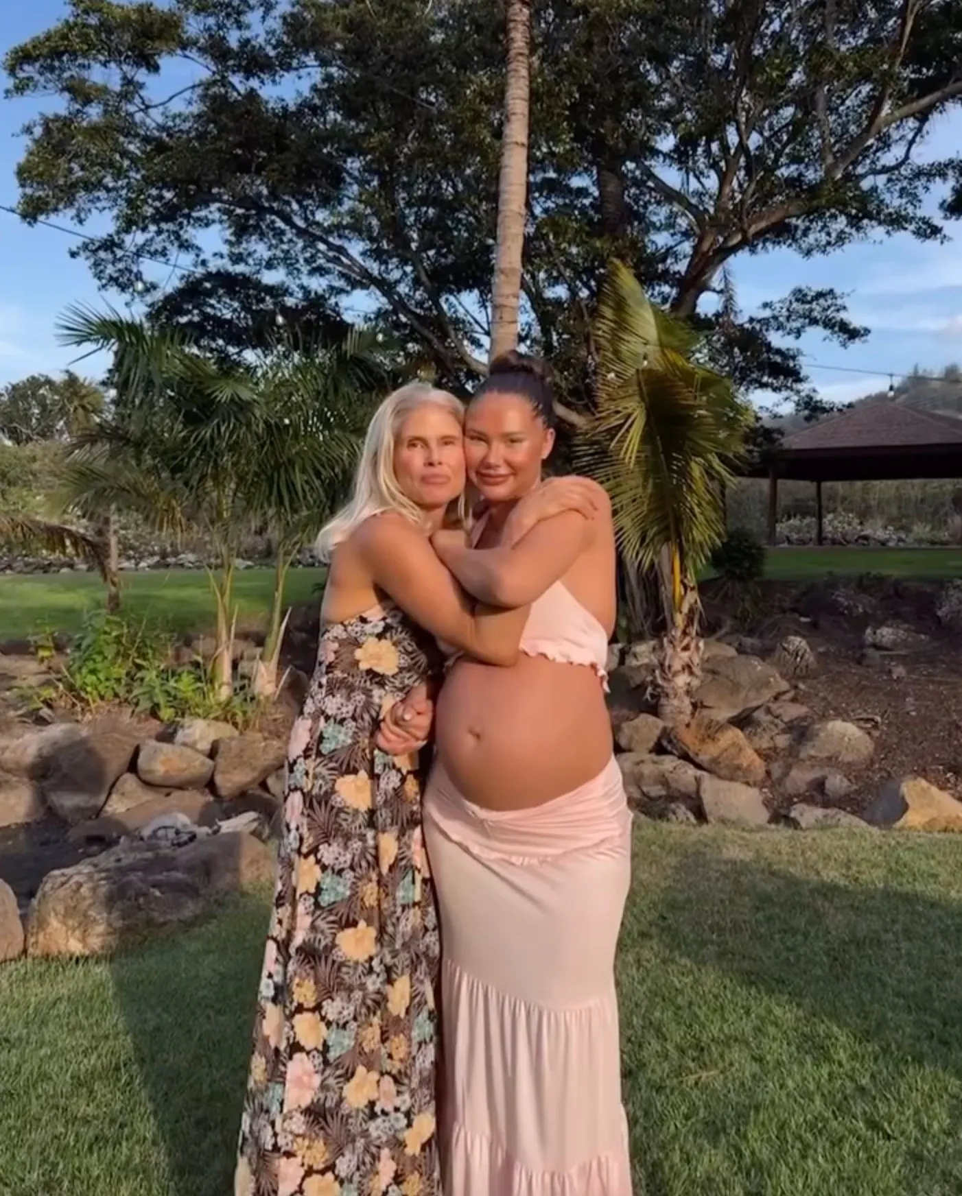 Sahara Ray embracing her mother outdoors.