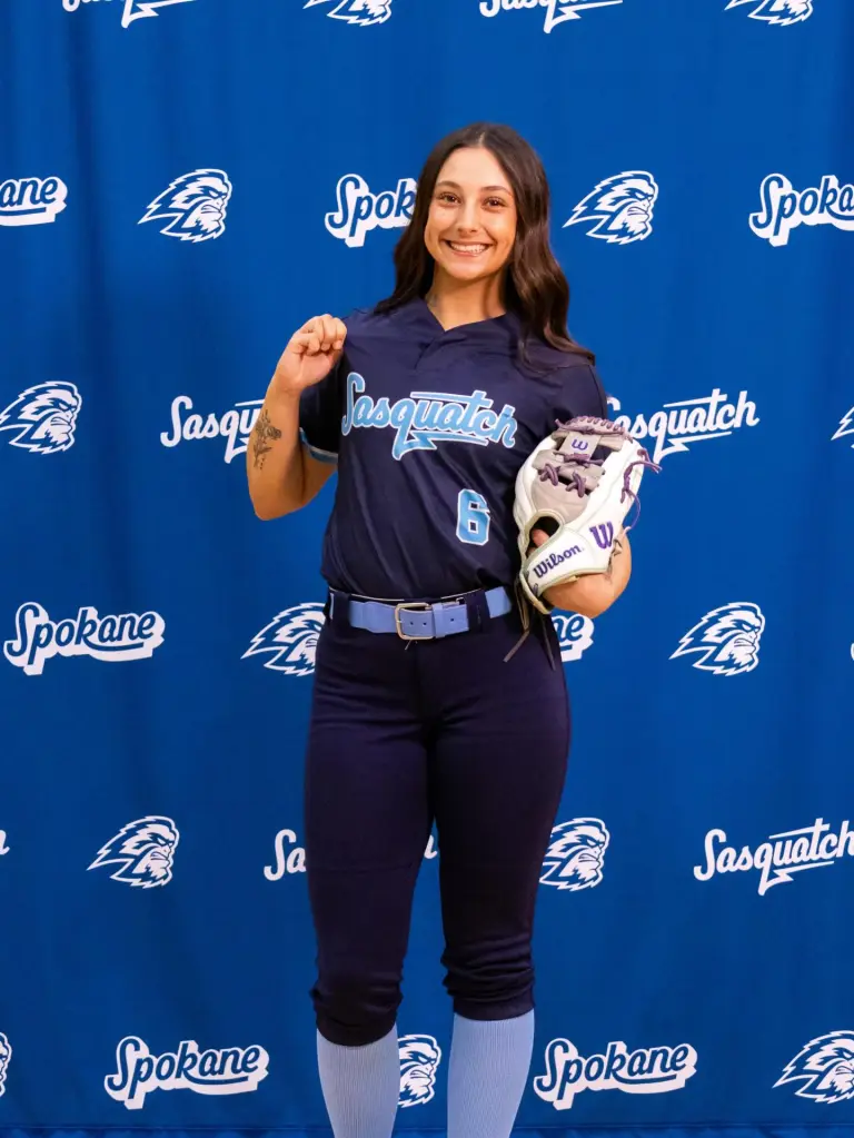 Samantha Rensvold, 19, posing in a softball uniform.