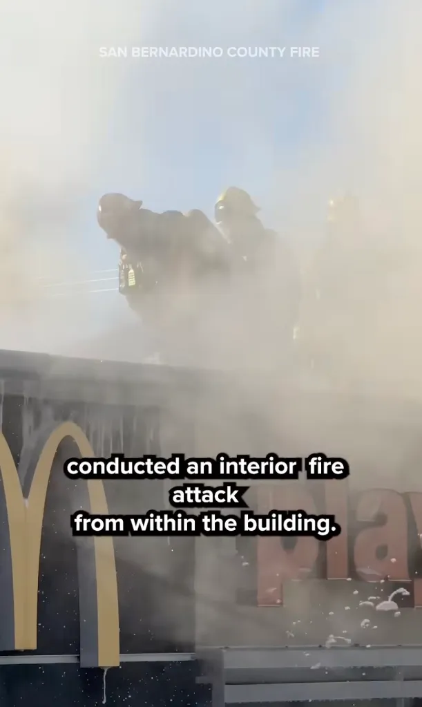 San Bernardino County Fire crews work at the scene of a fire at a McDonald's restaurant in north San Bernardino, California.