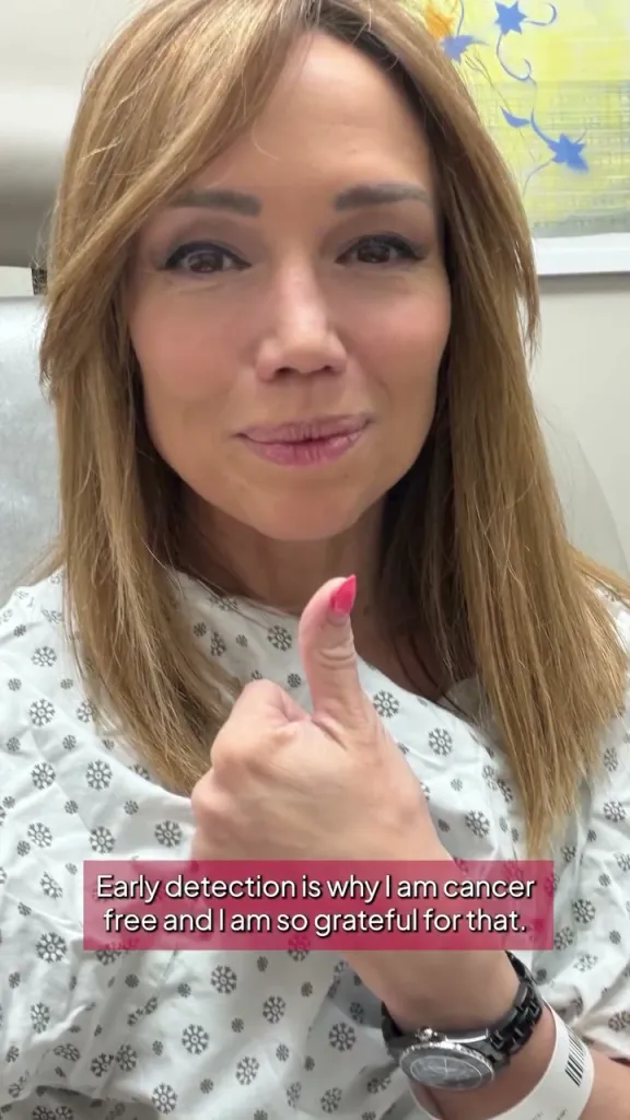 Sara Gore gives a thumbs-up while wearing a medical gown, with overlaid text reading, 