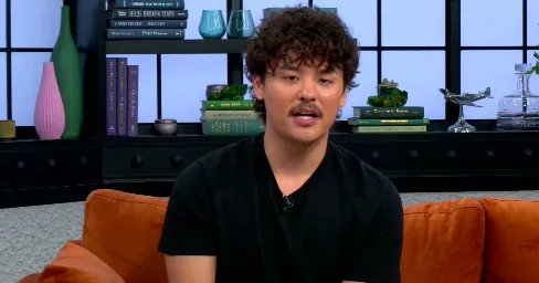 Collin Gosselin sitting on a couch for an interview.
