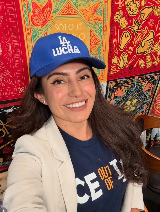 Sasha Renée Pérez smiling, wearing a blue 