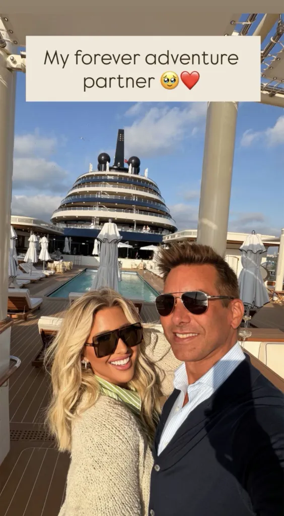 Savannah Chrisley and Jason Galanis take a selfie together on the deck of a yacht.