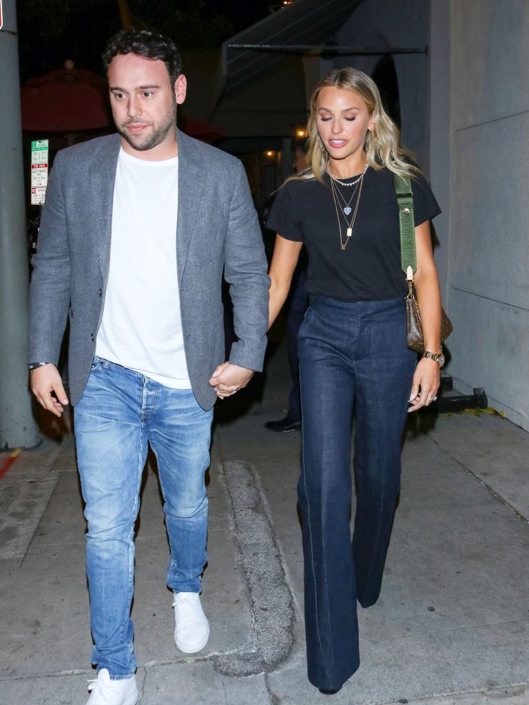 Scooter Braun and Yael Cohen holding hands.