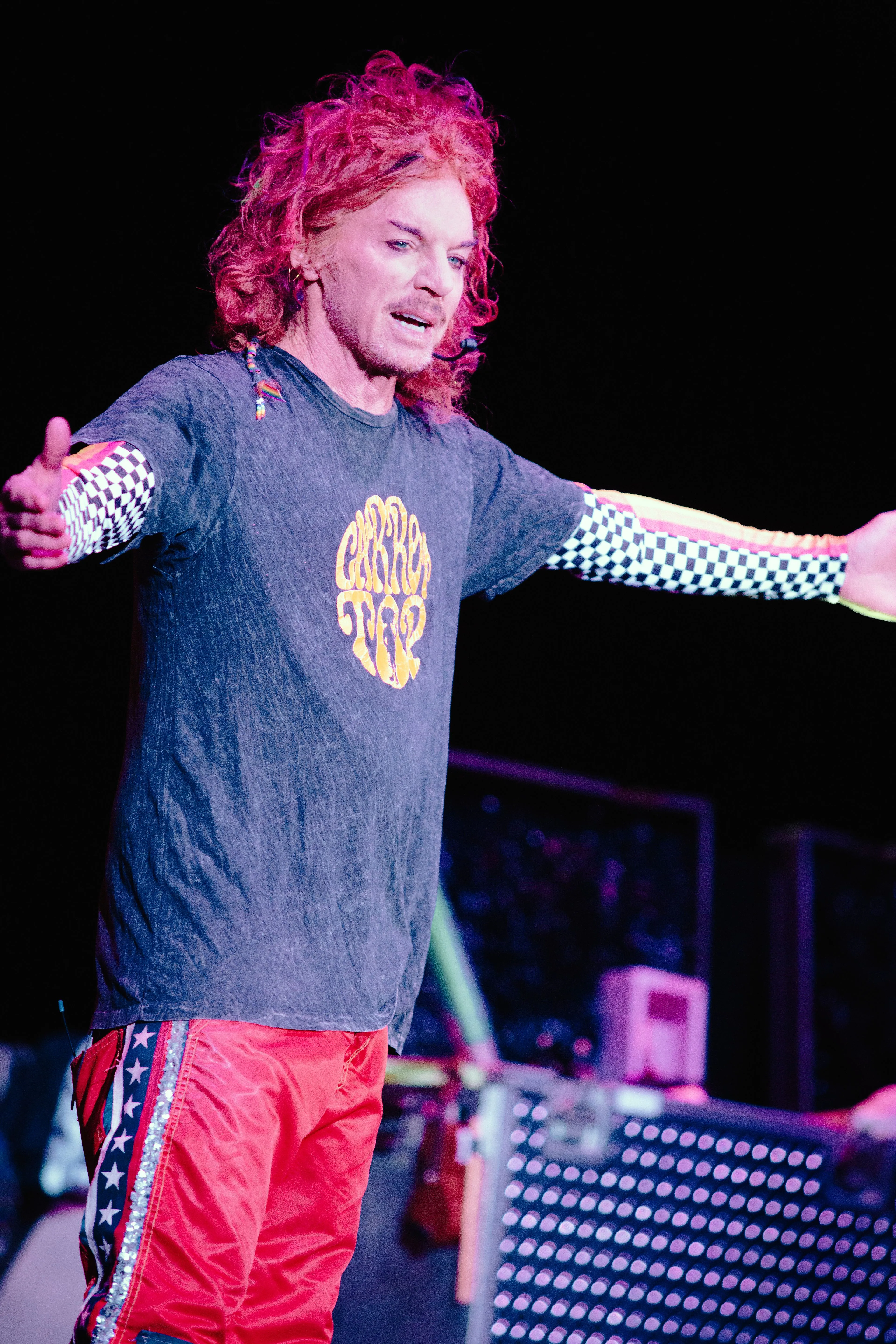 Comedian Carrot Top performing on stage.