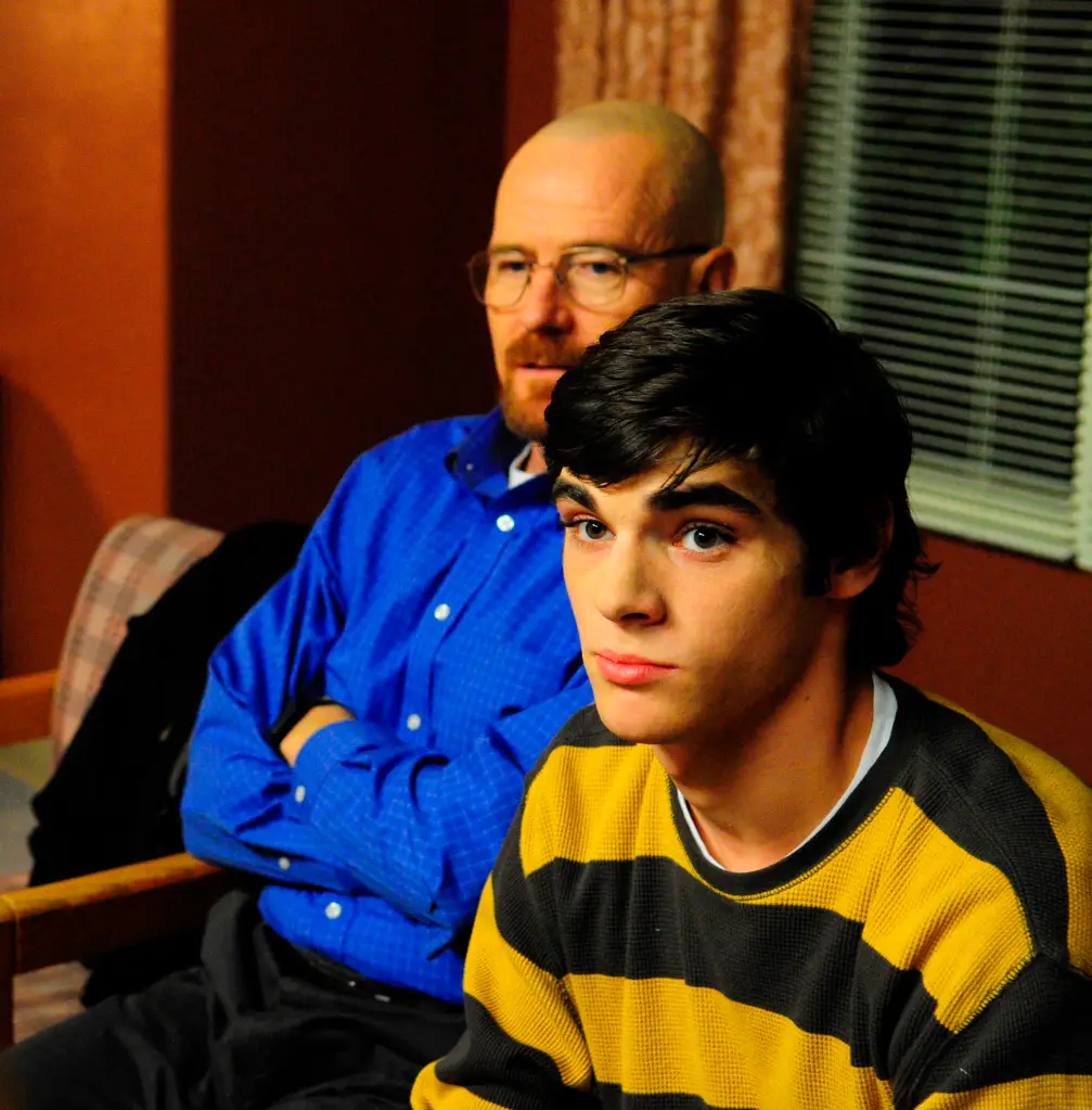 Walter White and Walter Jr. sitting indoors.