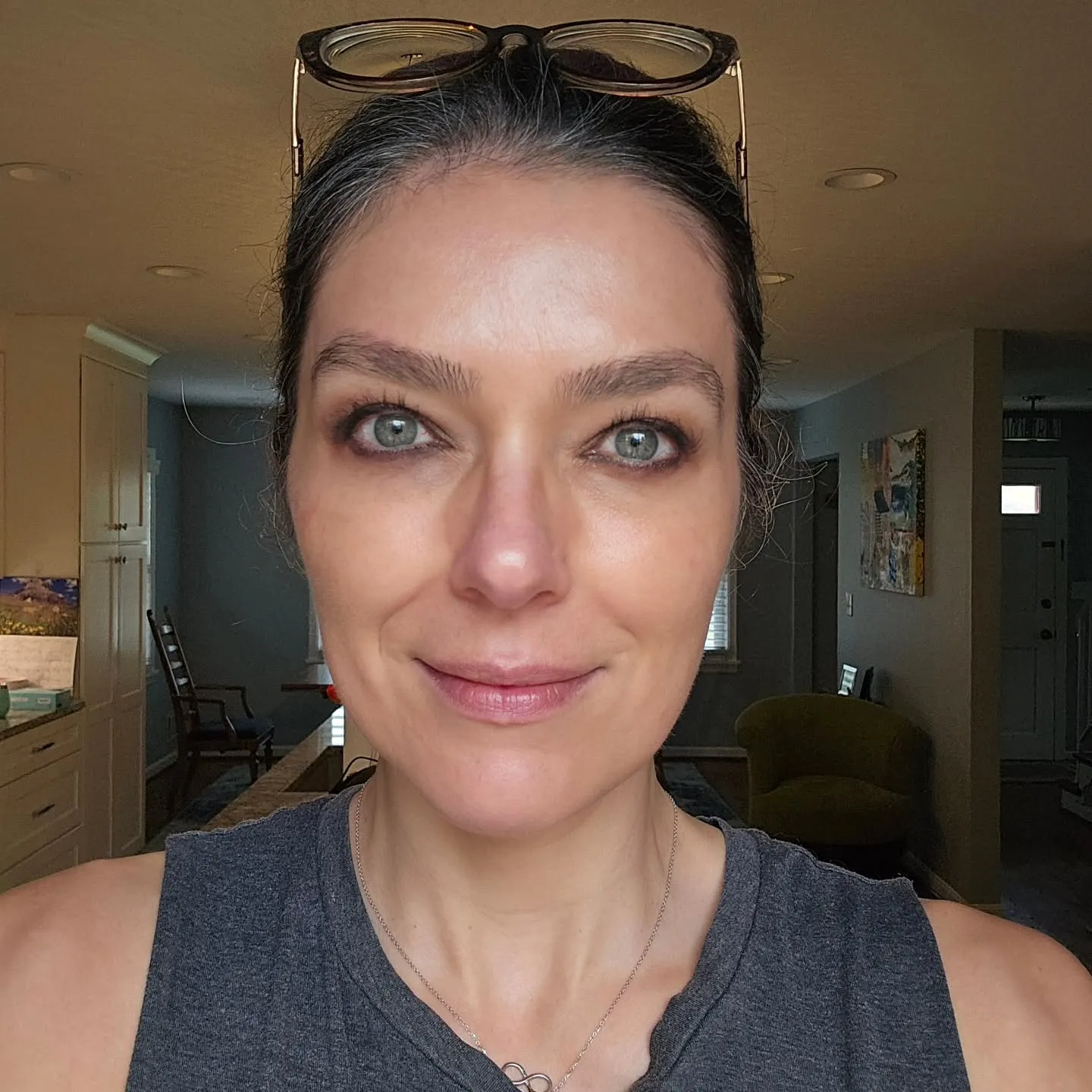 Adrianne Curry-Rhode with glasses on her head.