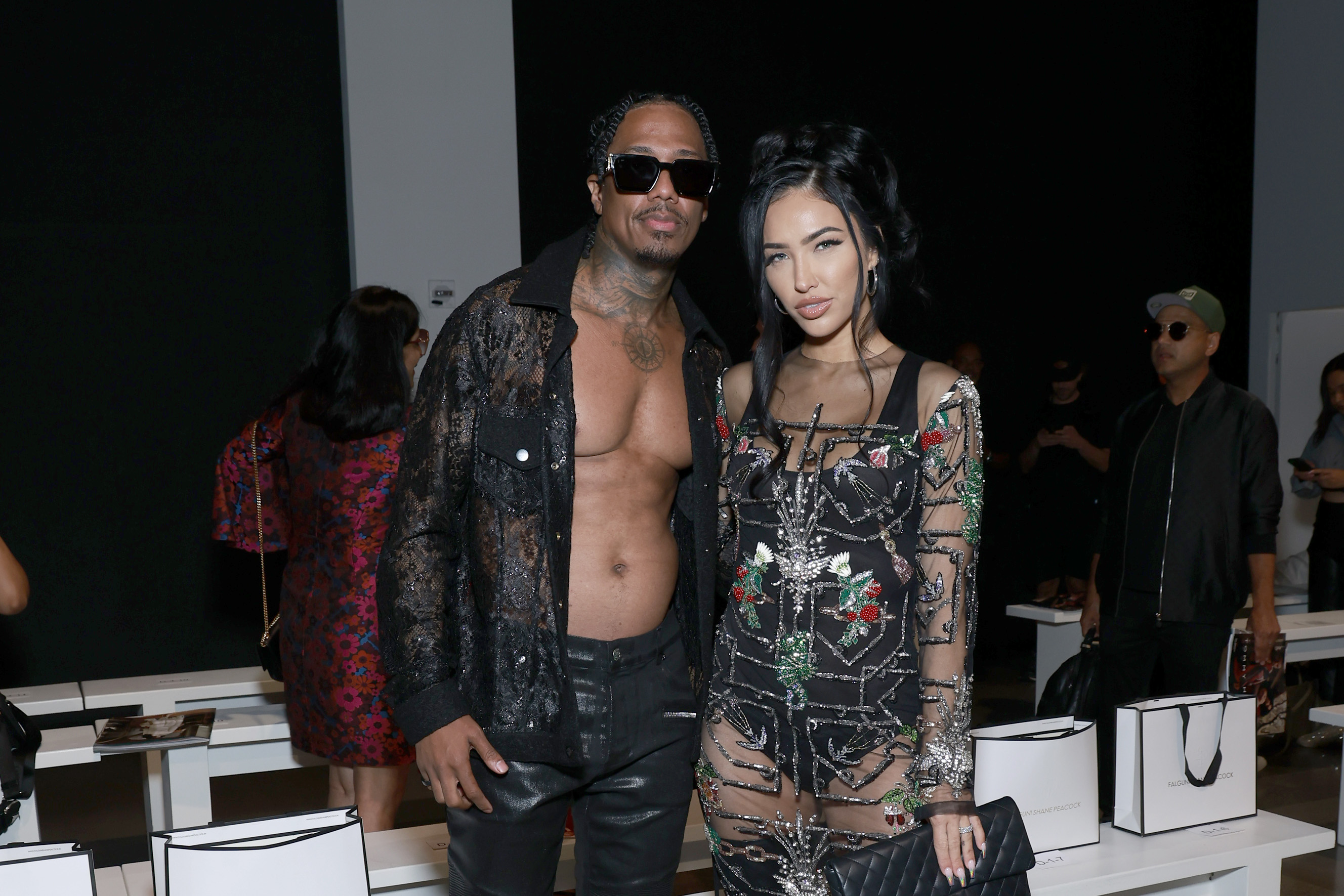 Nick Cannon and Bre Tiesi attend the Falguni Shane Peacock fashion show.