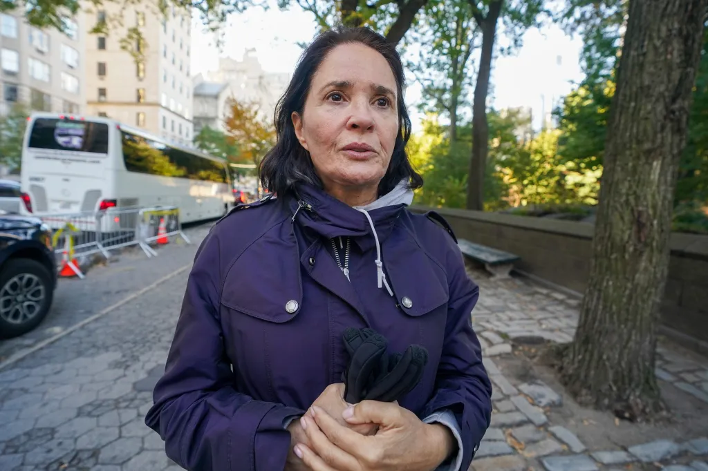 Shirley Kessel, visiting from out of town, speaks with a reporter near Central Park following a reported assault.