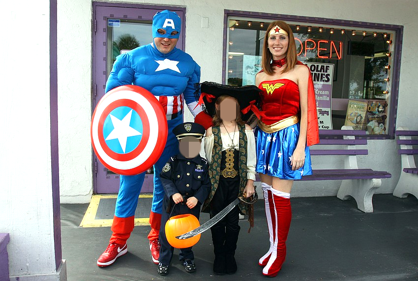 Mario, Jack, Marissa, and Ann Marie Govic trick-or-treat as a family throughout Siesta Key Village.
