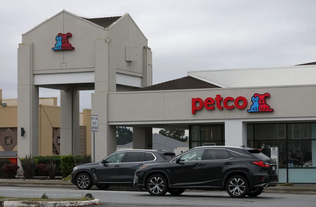 Exterior of a Petco store with cars parked in front.