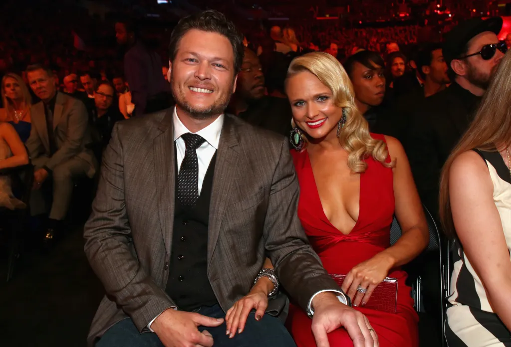 Blake Shelton and Miranda Lambert seated together at an awards ceremony.