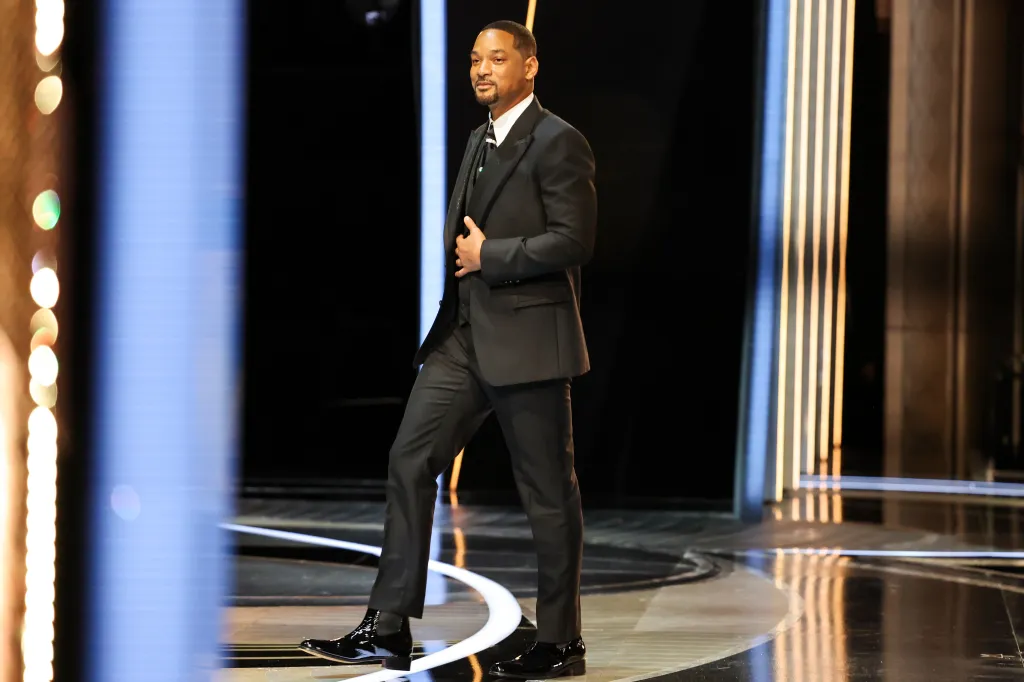 Will Smith holding his Oscar for best actor for King Richard backstage at the Academy Awards.