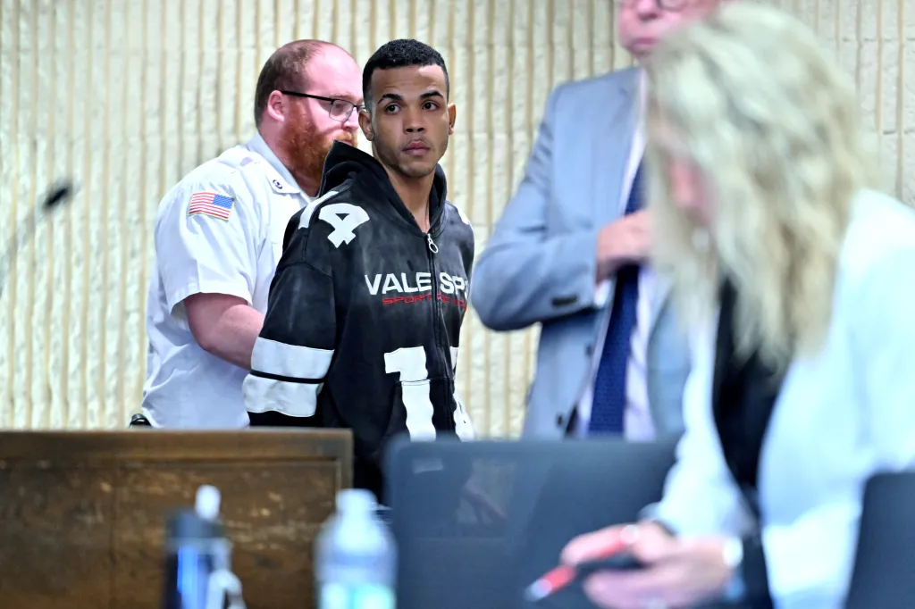 Sneider Mejia, 23, is brought into his arraignment in District court in Lynn, Mass.