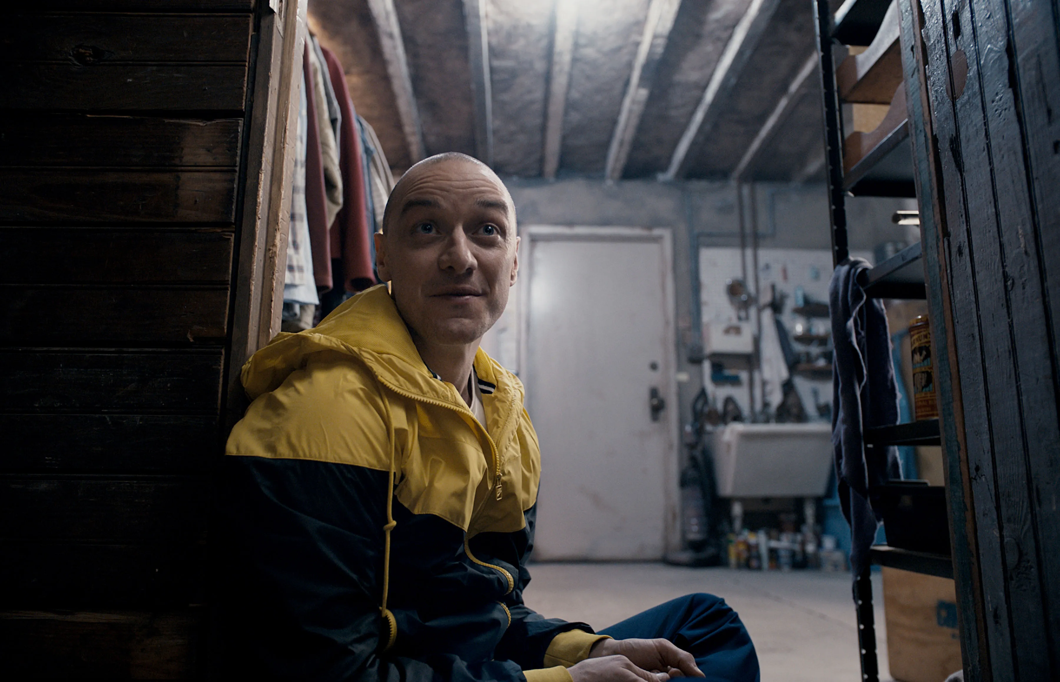 James McAvoy sitting in a basement in the film Split.