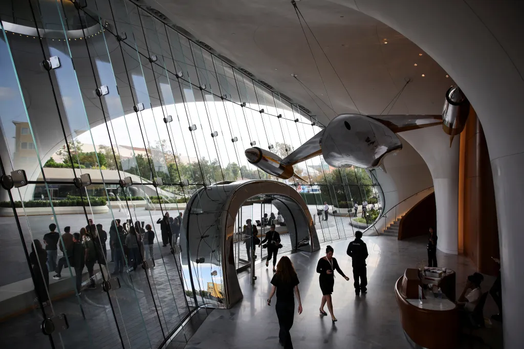Staff and visitors walk through the Lucas Museum of Narrative Art during its opening to the public in Los Angeles, California.