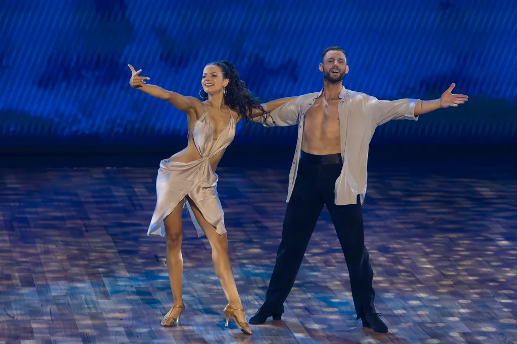 Dancers Adele and Allen perform a routine on stage.