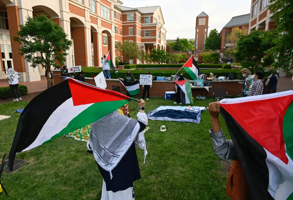 Pro-Palestinian demonstrators clash with police after replacing an American flag with a Palestinian flag on April 30, 2024, at UNC-Chapel Hill.