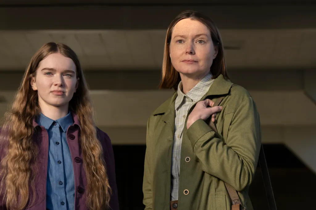Summer H. Howell and Samantha Sloyan stand side-by-side in outdoor lighting.