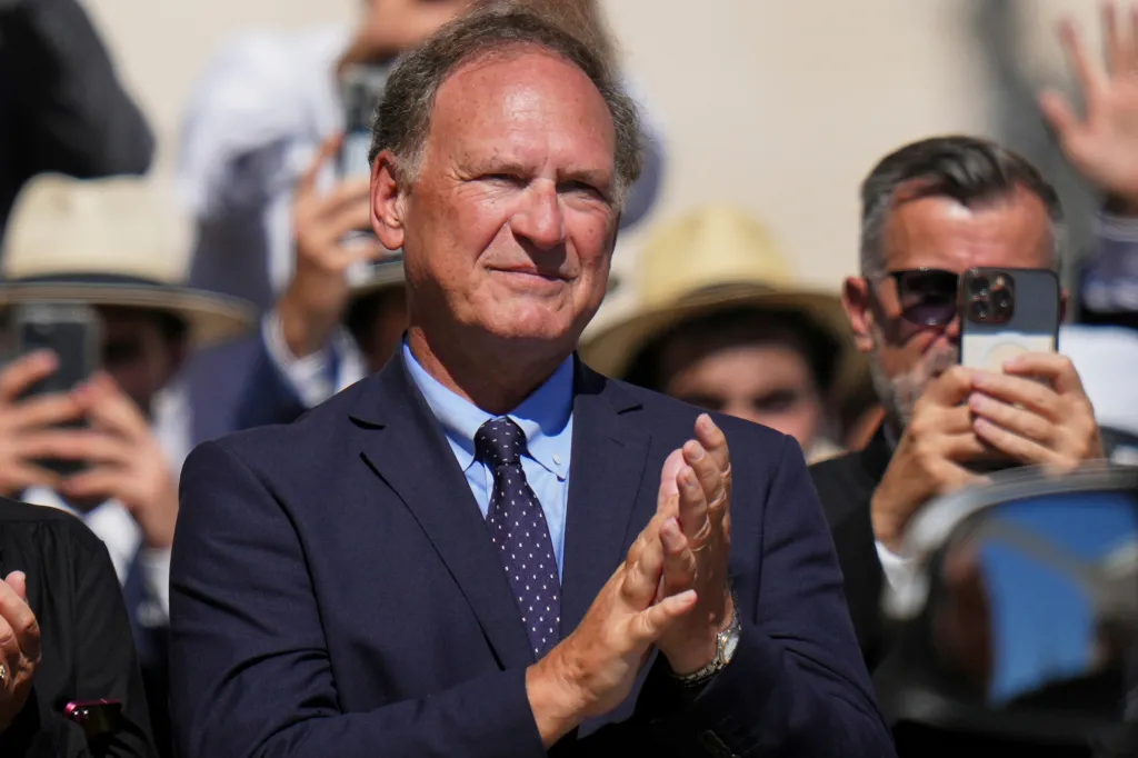 Supreme Court Justice Samuel Alito applauds during an audience at the Vatican.
